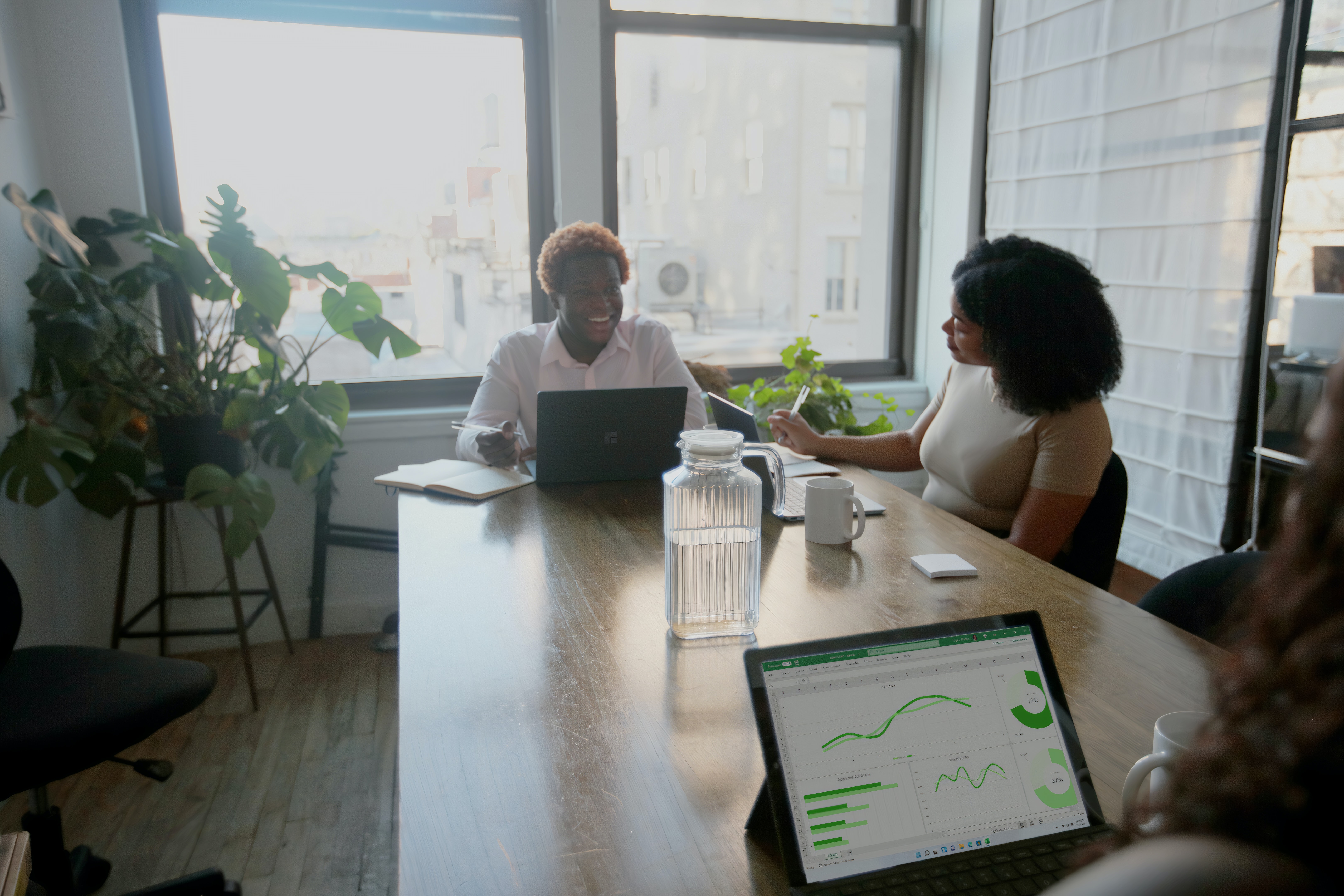 Parents at a table during a divorce mediation session discussing finances